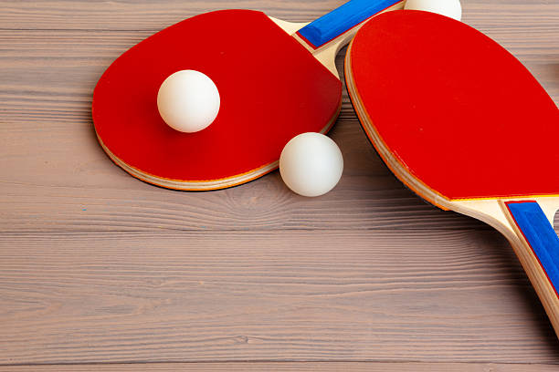 Ping pong equipment on wooden table close up