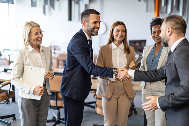 istock Business Team Engaging in Professional Handshake at Office 2251475666