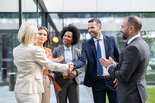 istock Professionals Sharing Ideas and Insights Outdoors Together 2251475704
