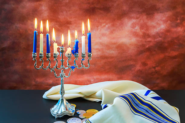 istock Celebration with menorah coins during Hanukkah at home setting in evening 2251476836