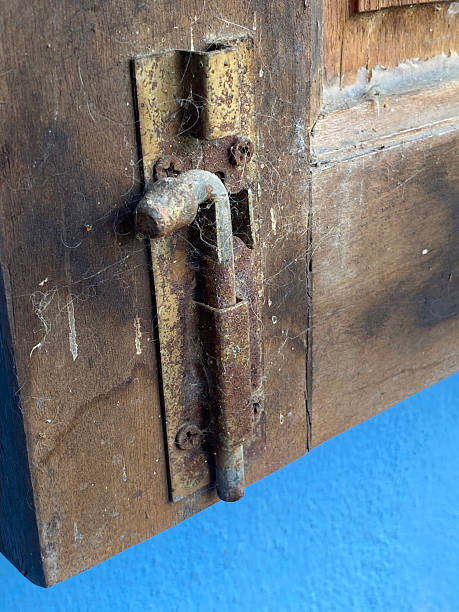 istock padlock on wooden window 2251478662