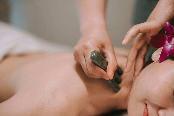 istock Asian Jade Stone Neck Massage in Relaxing Spa 2251479605
