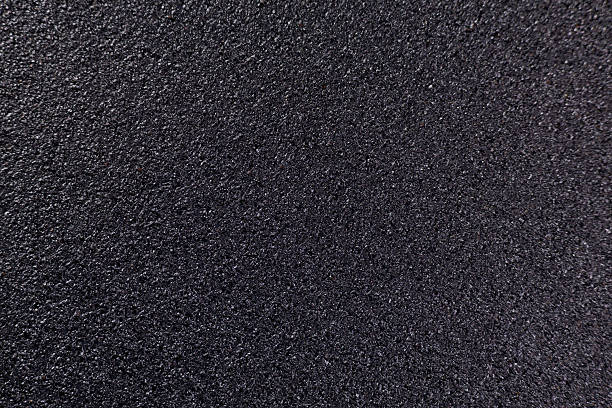 Texture of a black sandpaper in a close up view