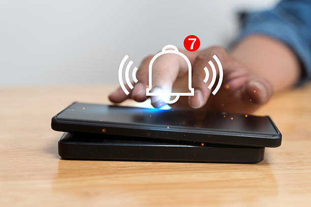 istock Smartphone Notification Alert Icon Appearing as Hand Touches Screen Showing Digital Message 2251486287