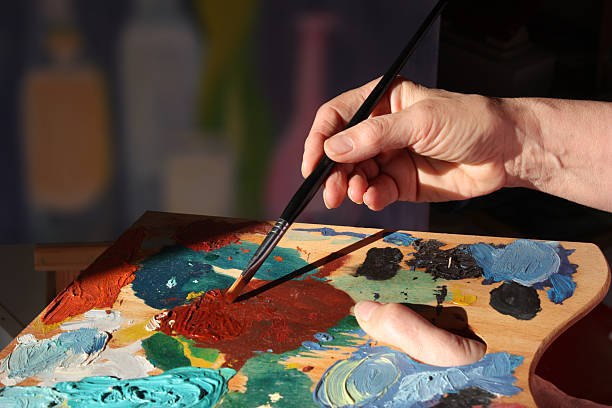 istock Art painting workshop. Painter in action. 2251490203