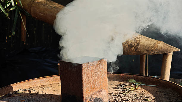 istock Smoke stacks from traditional charcoal production. 2251490871