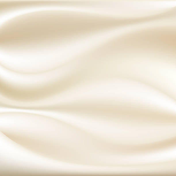 istock Luxurious soft silk or satin fabric texture background in flowing gentle waves, elegant cream and ivory colors for beauty, wedding, and cosmetic design concepts 2251494373