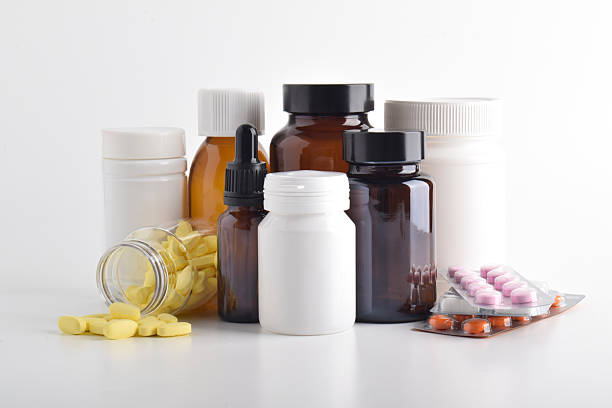 istock Various pills and medicine bottles on a white background 2251494648