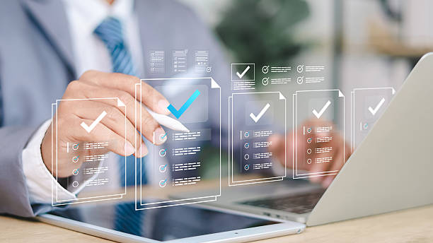 istock Businessman showing online document validation icon, quality assessment management With a checklist, business document evaluation process, market data report analysis and consulting. 2251496587