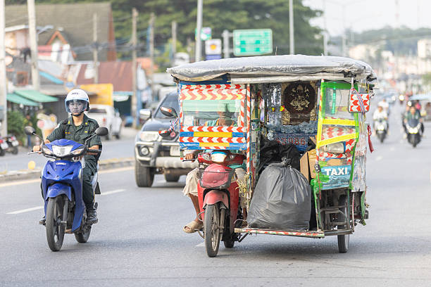 La Carlota City, Philippines – February 01, 2019: A busy city street with tricycles and motorbikes in the Philippines