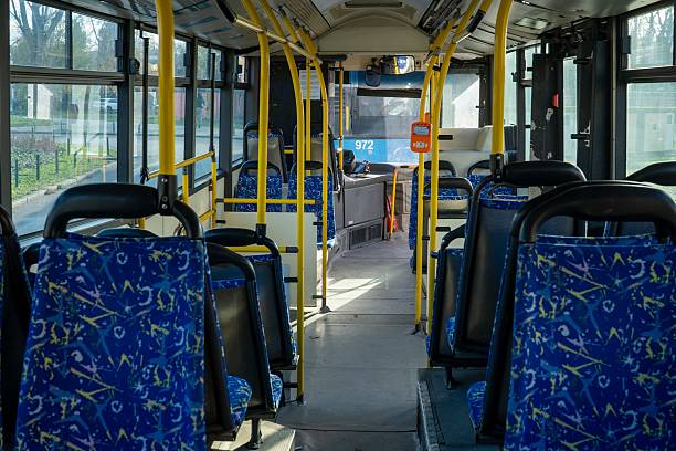 istock Modern city bus interior with bright blue passenger seats 2251497654