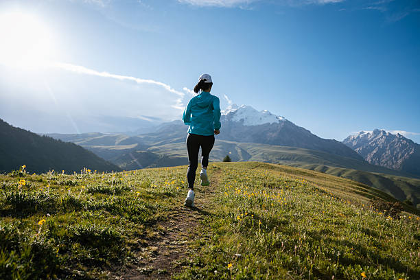 istock Trail runner running on the high altitude grassland mountain top trail 2251500590