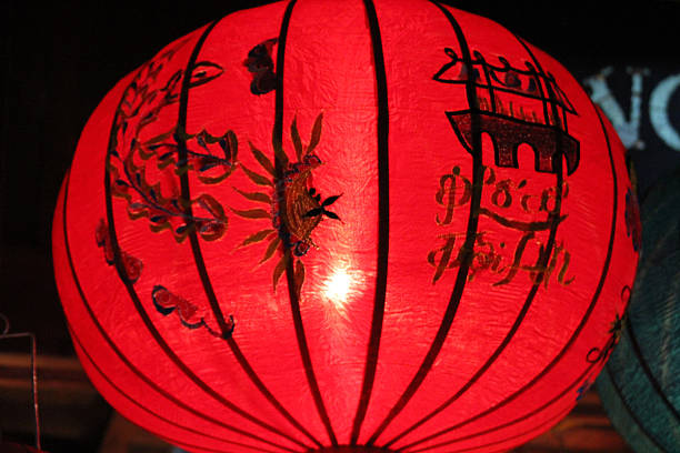 istock EXCU low angle red silk lantern at night market stall 2251500640