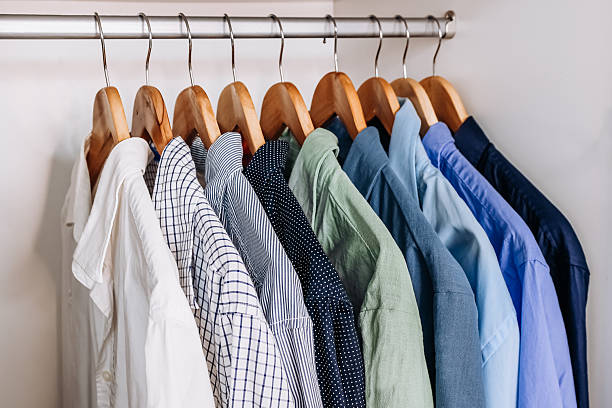 istock Color-coordinated shirts hanging in wardrobe 2251502126
