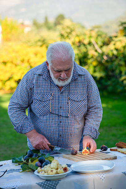 Cooking process showing a man slicing figs for a sweet fig pastry recipe