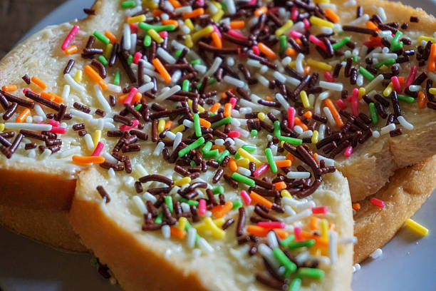 istock White bread sprinkled with colorful chocolate sprinkles 2251503757