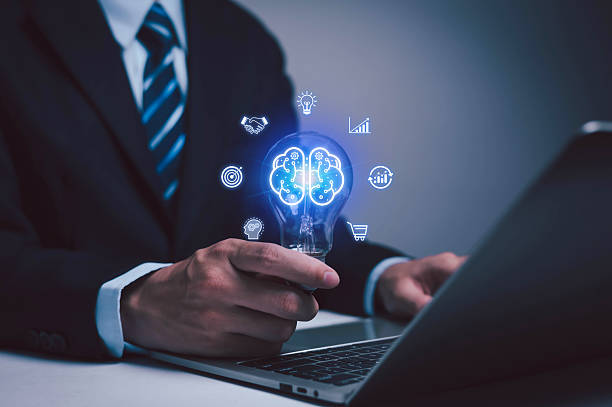istock Innovation concept and inspiration. Man holding creative light bulb with question mark icon. Industrial and marketing development network. Strategic planning. 2251503816