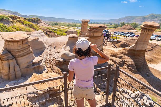 Ancient Badlands Terrain with Exposed Rock Layers. Natural Badlands Scenery with Sedimentary Rock Layers. Geological Formations in the Badlands with binoculars or a telescope