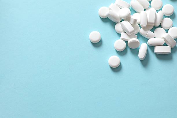 istock Various medical pills on a colored background 2251509011