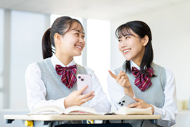 istock High school girl using a smartphone in the classroom 2251510343