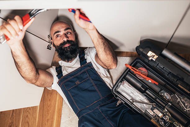 istock Professional plumber repairing kitchen sink 2251511848