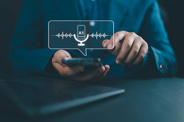 istock AI voice assistant technology concept. Businessman using speech recognition on smartphone with virtual microphone icon and soundwave. Future of mobile AI interface. 2251513125