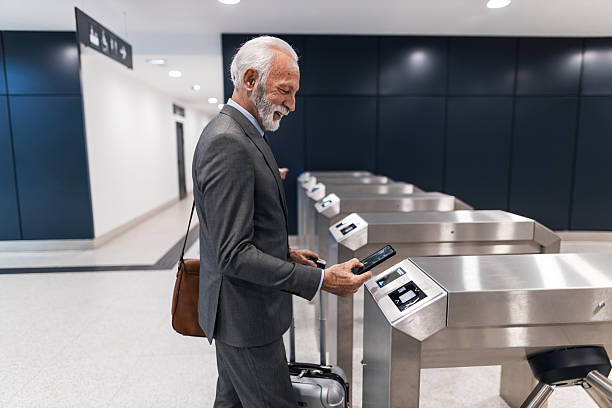 istock Businessman Using Smartphone for Access at Turnstile in Modern Interior 2251514251