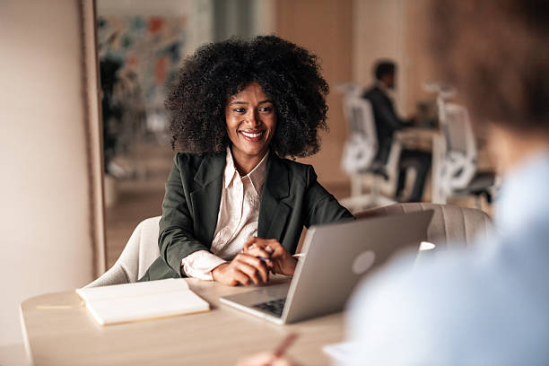 istock Confident Professional Woman Working on Laptop in Modern Office 2251515690