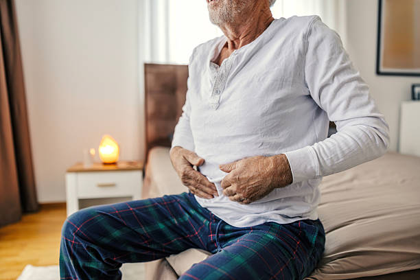istock Senior man experiencing stomach pain in bed 2251518424
