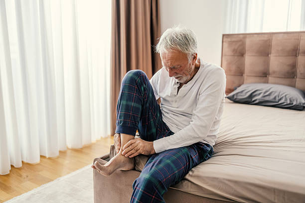 istock Senior man experiencing ankle pain in morning 2251519154