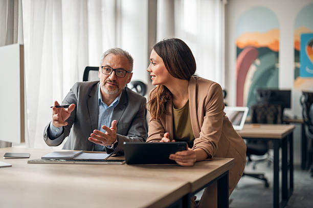 istock Business Professionals Collaborating in a Modern Office Environment 2251531045