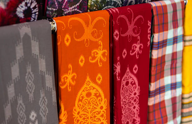 istock Colorful Sarung Tenun Samarinda fabrics on display. These traditional hand-woven textiles from East Kalimantan are a proud part of Indonesian cultural heritage, celebrated alongside Batik. 2251533592