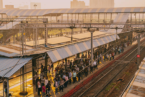istock Busy Indian railway station with crowded platform and tracks 2251534184