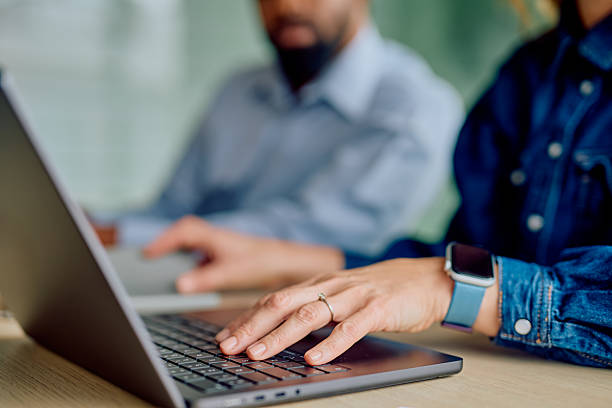 istock People working on laptops in a modern office 2251534329