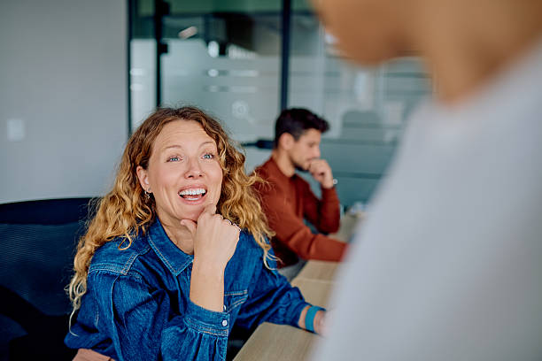 istock Professionals having conversation during team office meeting 2251536092
