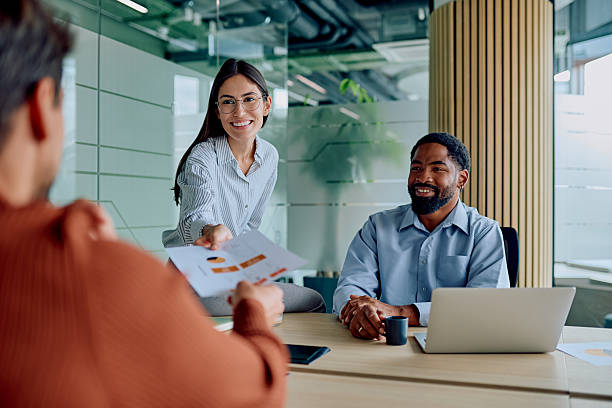 istock Diverse business team collaborating on project report in office 2251536101