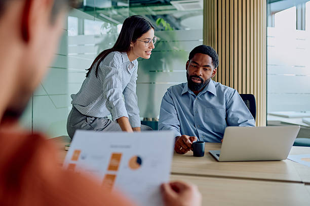 istock Diverse business team collaborating on project in modern office 2251536108