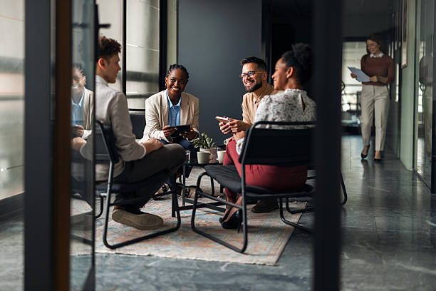 istock Group of Diverse Professionals Engaged in a Casual Office Discussion 2251536996
