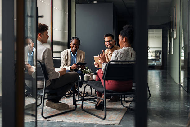 istock Professional Meeting of Colleagues in a Modern Office Setting 2251537005