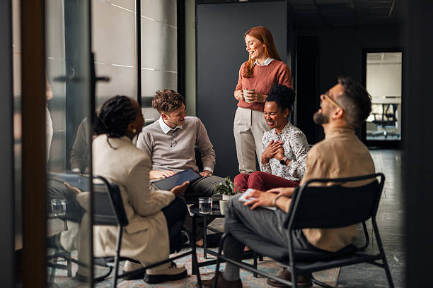 istock Group Colleagues Enjoying Informal Discussion in a Modern Collaborative Office Space 2251537058