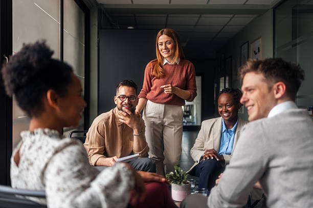 istock Group of Diverse Professionals Discussing Ideas in a Modern Office Setting 2251537189