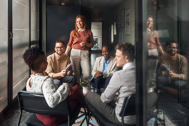 istock Professional Team Engages in Productive Group Discussion in Modern Office Space 2251537212