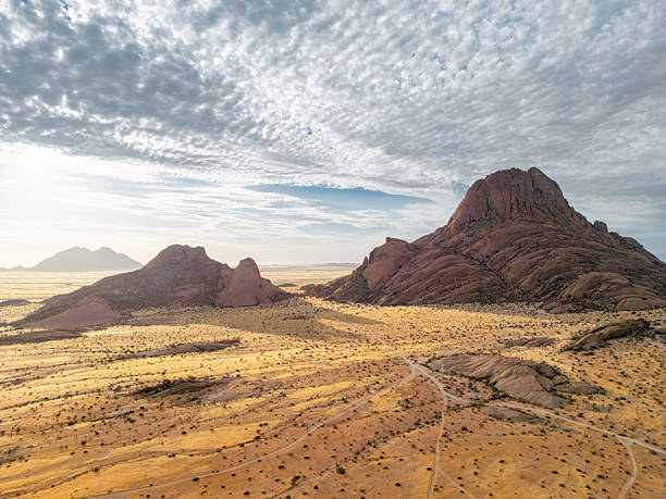 drone view on rock landscape of spitzkoppe at sunset hour in the namib dessert