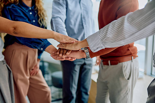 istock Business team showing unity and collaboration in office 2251538554