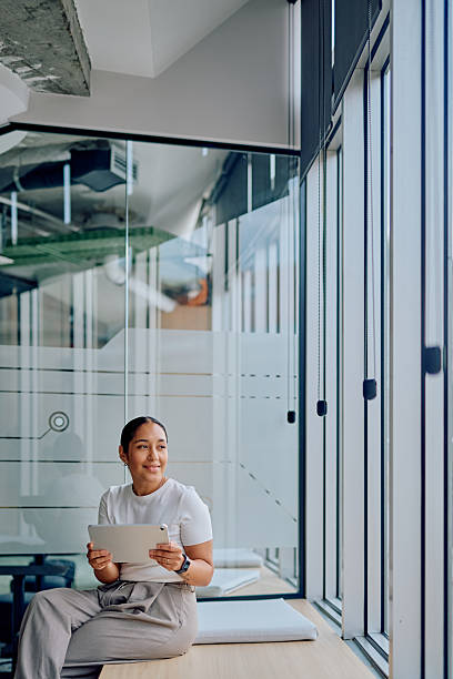 istock Woman working on tablet in modern office 2251539199