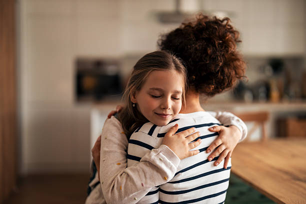 istock Loving Moment Between Parent and Child Hugging in a Cozy Home Setting 2251542254