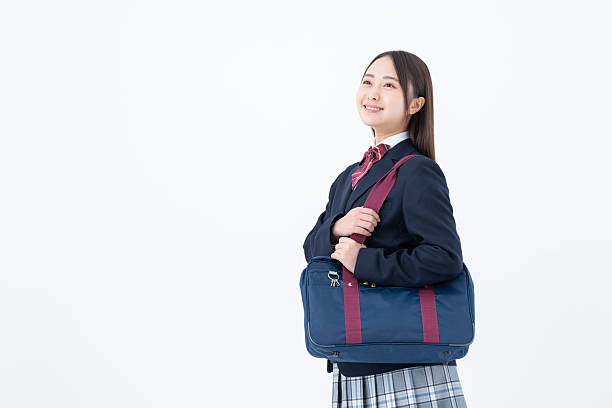 istock High school girl on white background 2251547013