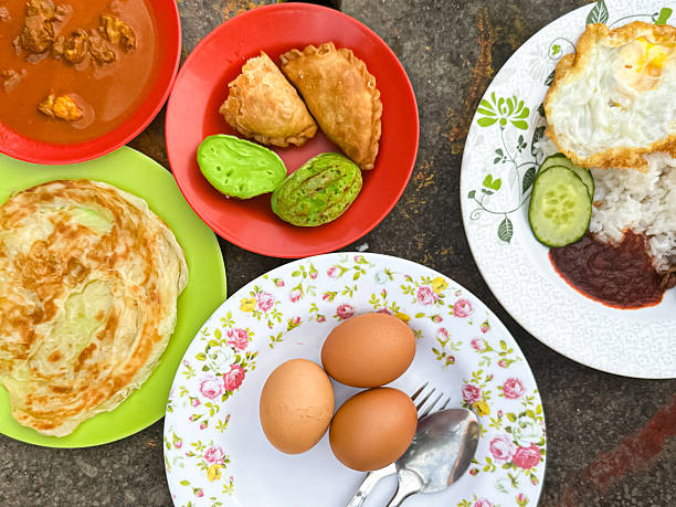 Traditional Malaysian Breakfast Assortment on Colorful Plates