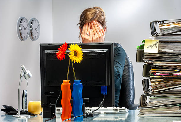 istock Young woman in office working late. 2251547393