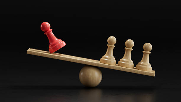 istock Red Pawn vs Three Beige: Representing Proportional Influence 2251548195
